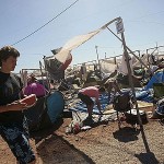Campers return to the Benicassim campsite after the freak storms